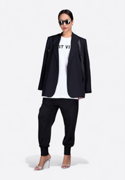 Close-up of black leather belted blazer, front view – East Vibe